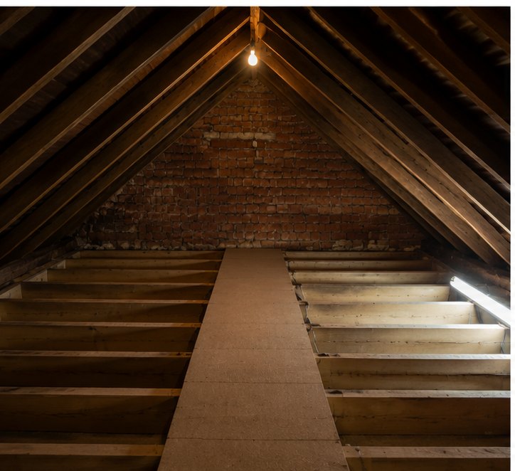 Loft floor before insulation in Basingstoke — exposed joists